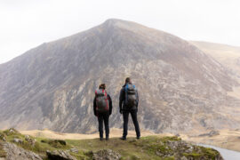 Two Experienced Hikers Gazing at a Summit