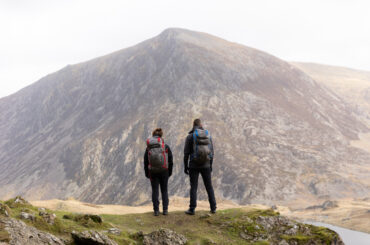 Two Experienced Hikers Gazing at a Summit